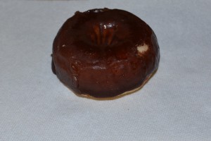 Defrosted chocolate frosted donut.